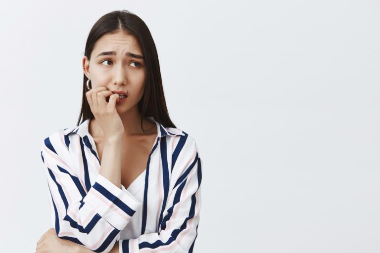 Nervous student with ADHD in striped blouse.